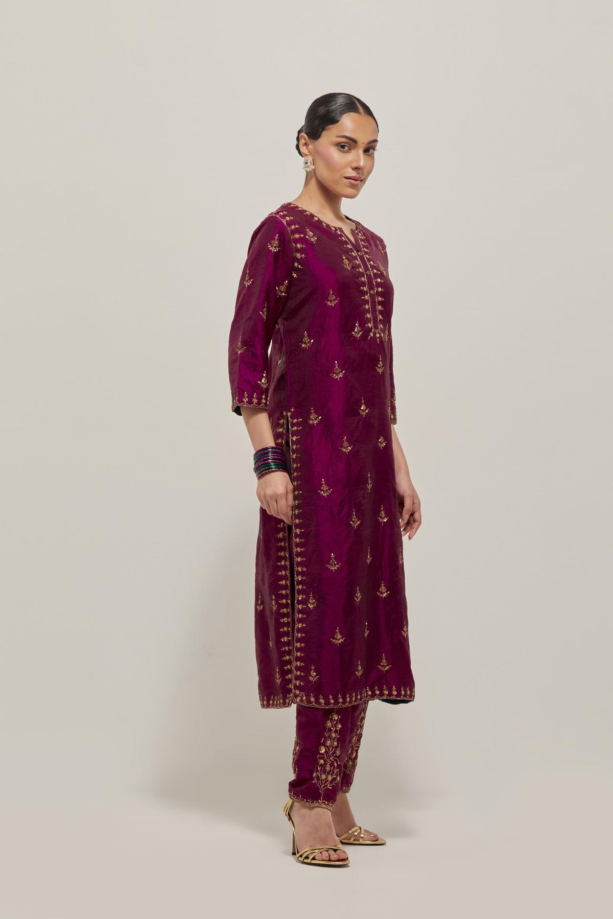 Wine double toned silk straight kurta with all-over hand embroidered zardozi and sequins work, highlighted with beads.