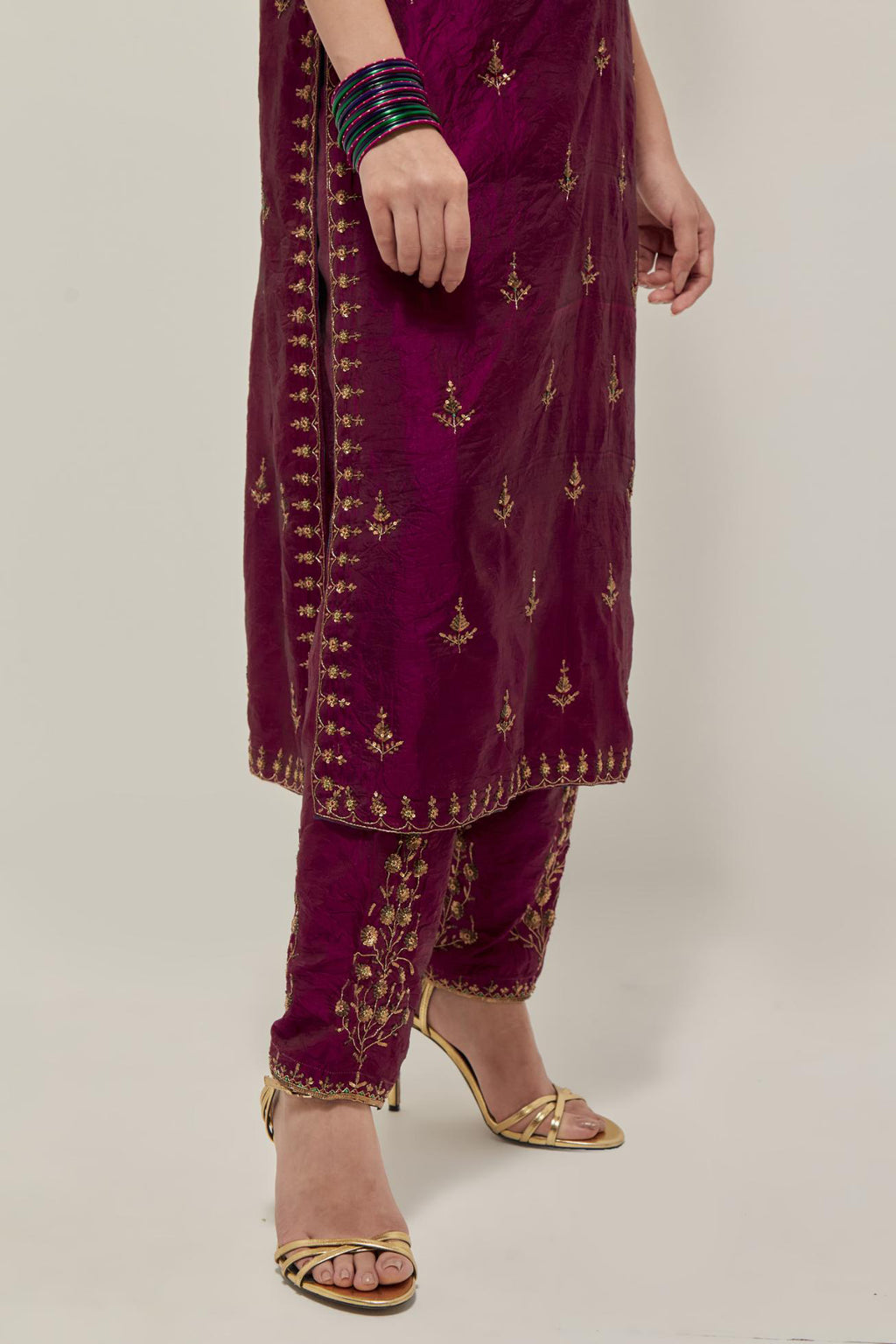 Wine double toned silk straight kurta with all-over hand embroidered zardozi and sequins work, highlighted with beads.