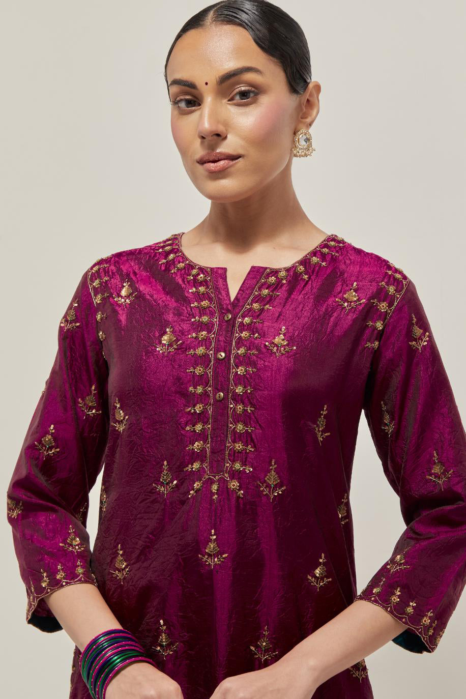 Wine double toned silk straight kurta with all-over hand embroidered zardozi and sequins work, highlighted with beads.