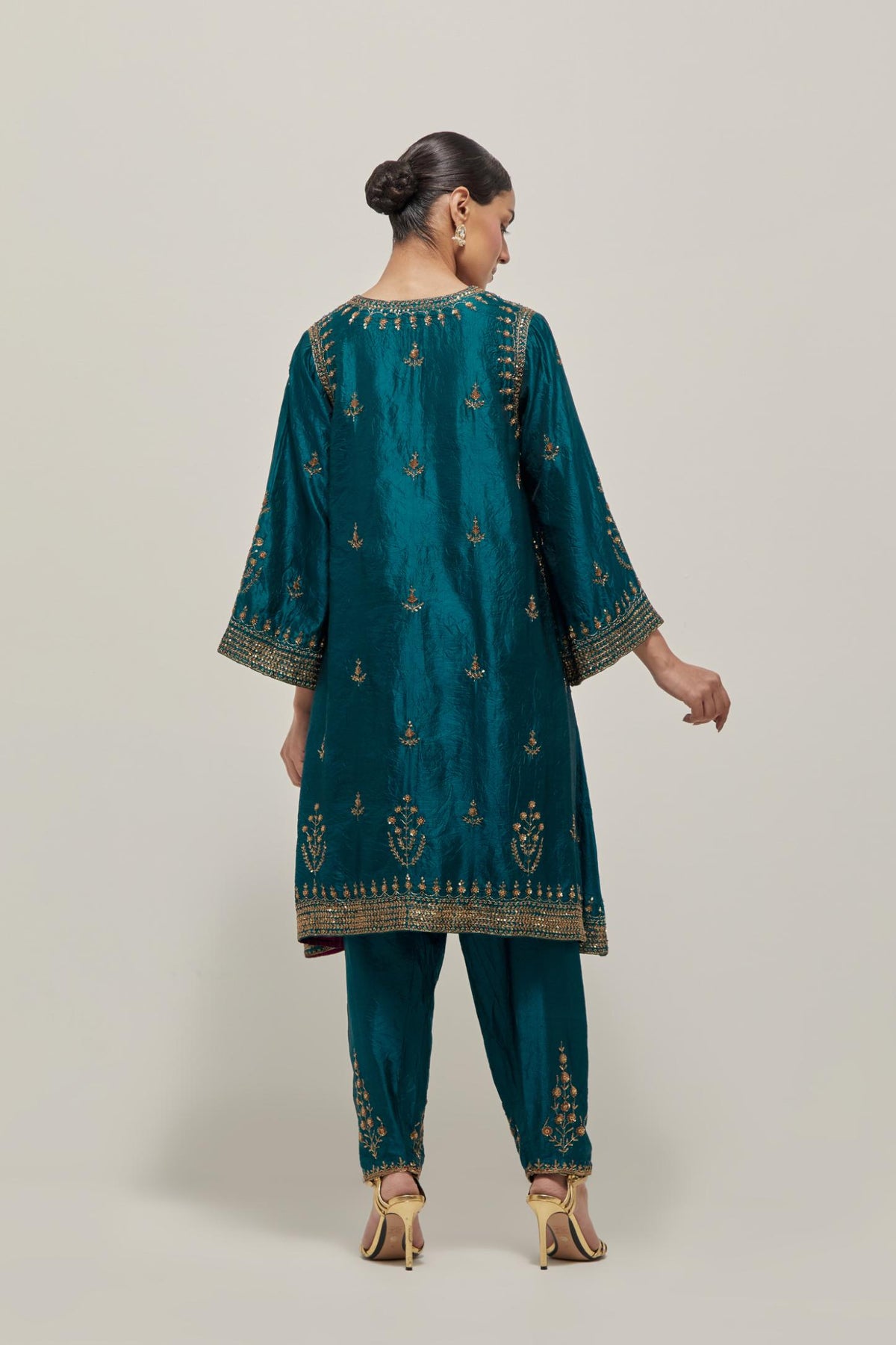 Teal Green double toned silk easy fit short kurta set with hand embroidered zardozi and sequins, highlighted with beads.
