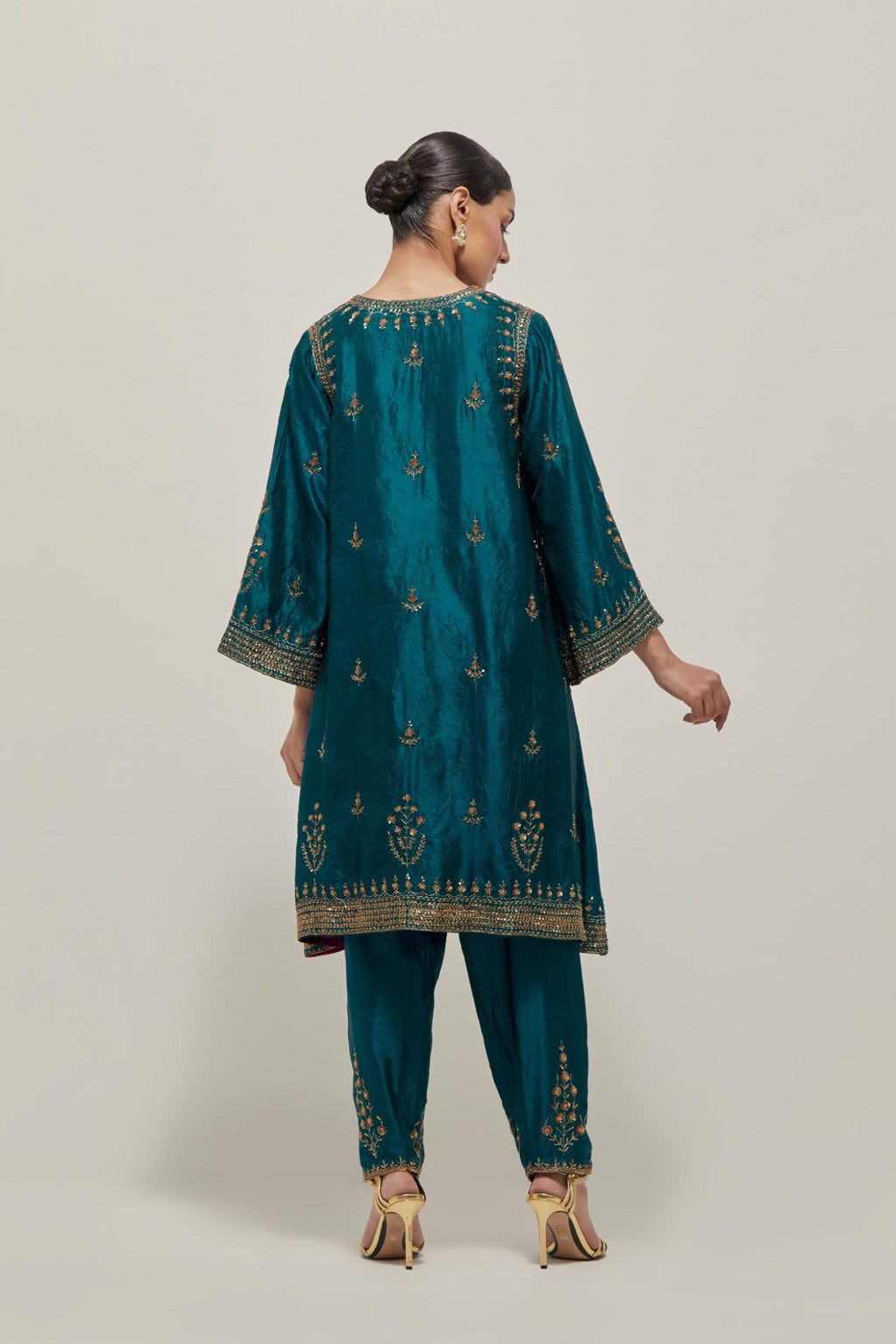 Teal Green double toned silk easy fit short kurta set with hand embroidered zardozi and sequins, highlighted with beads.
