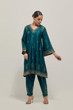 Teal Green double toned silk easy fit short kurta set with hand embroidered zardozi and sequins, highlighted with beads.