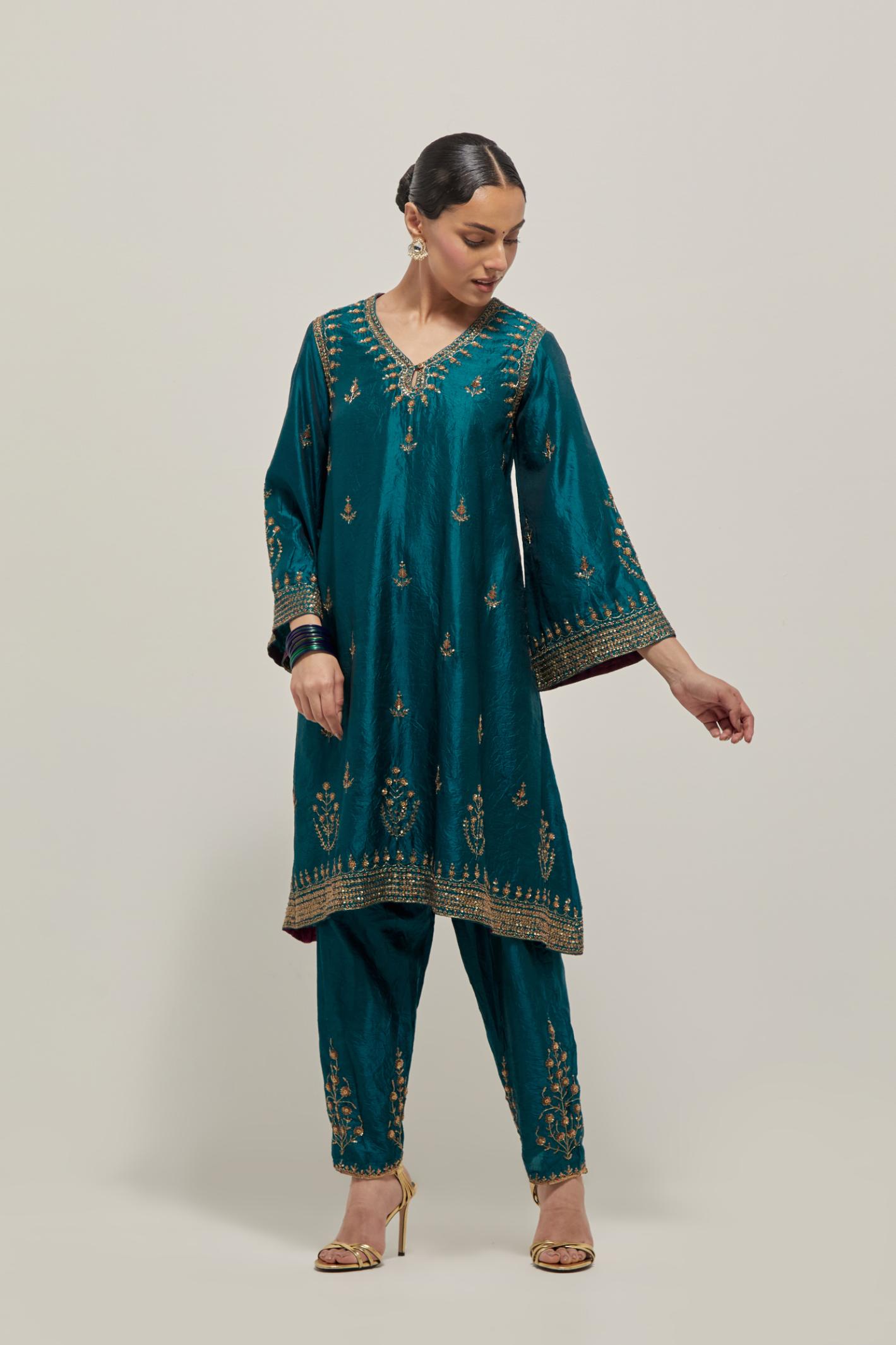 Teal Green double toned silk easy fit short kurta set with hand embroidered zardozi and sequins, highlighted with beads.