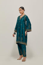 Teal Green double toned silk easy fit short kurta set with hand embroidered zardozi and sequins, highlighted with beads.