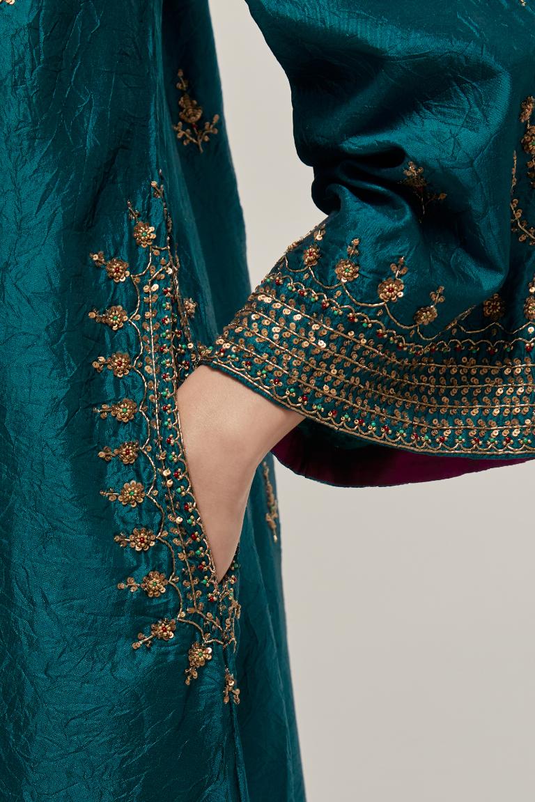 Teal Green double toned silk easy fit short kurta set with hand embroidered zardozi and sequins, highlighted with beads.