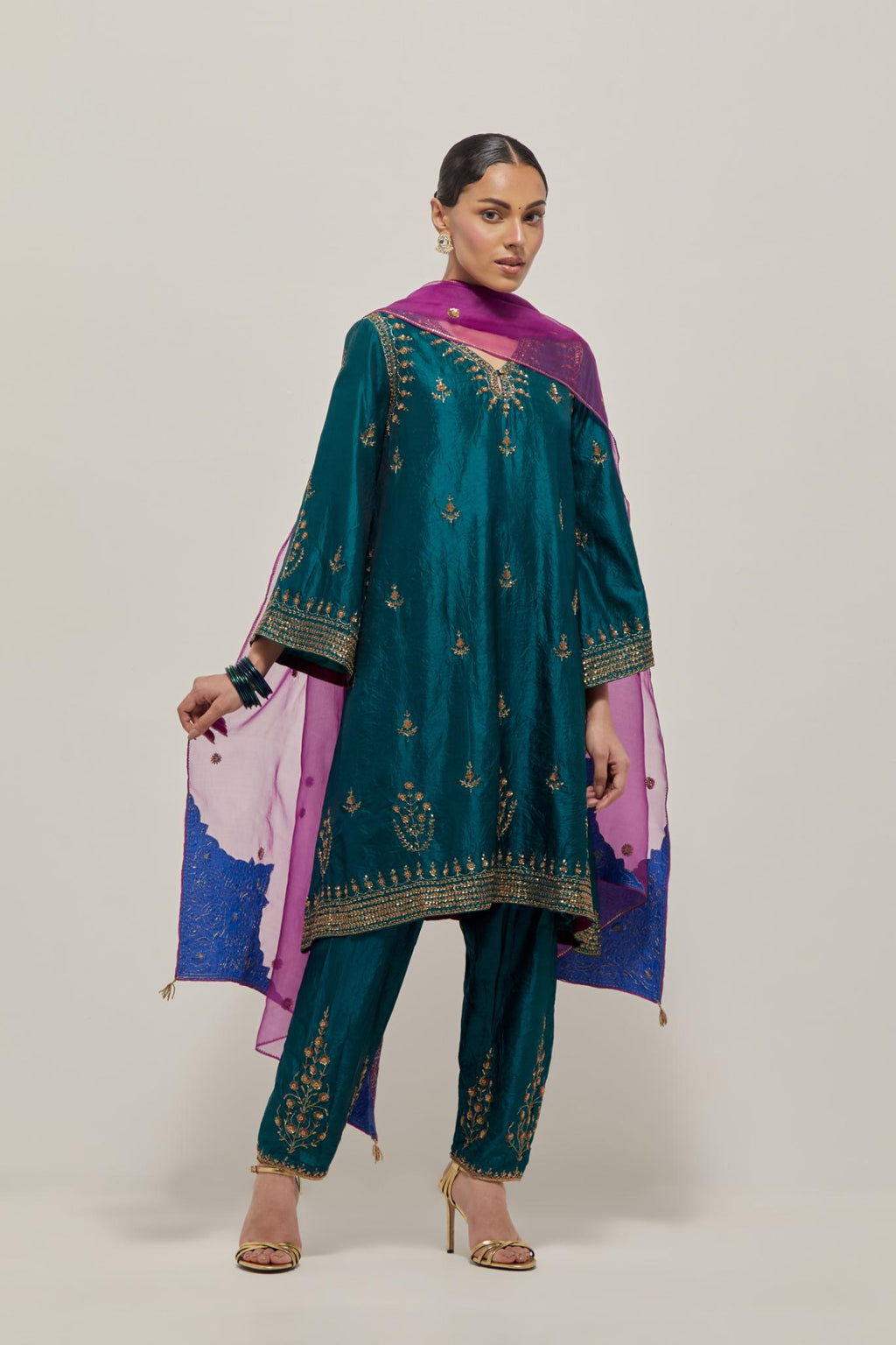 Teal Green double toned silk easy fit short kurta set with hand embroidered zardozi and sequins, highlighted with beads.