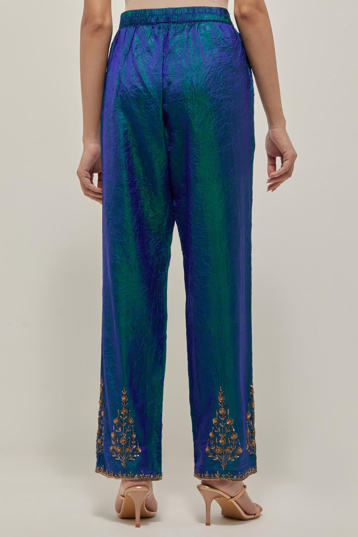 Teal Blue Silk pants, highlighted with hand embroidered bead, sequins and zardozi boota at hem, highlighted with contrast bead work.