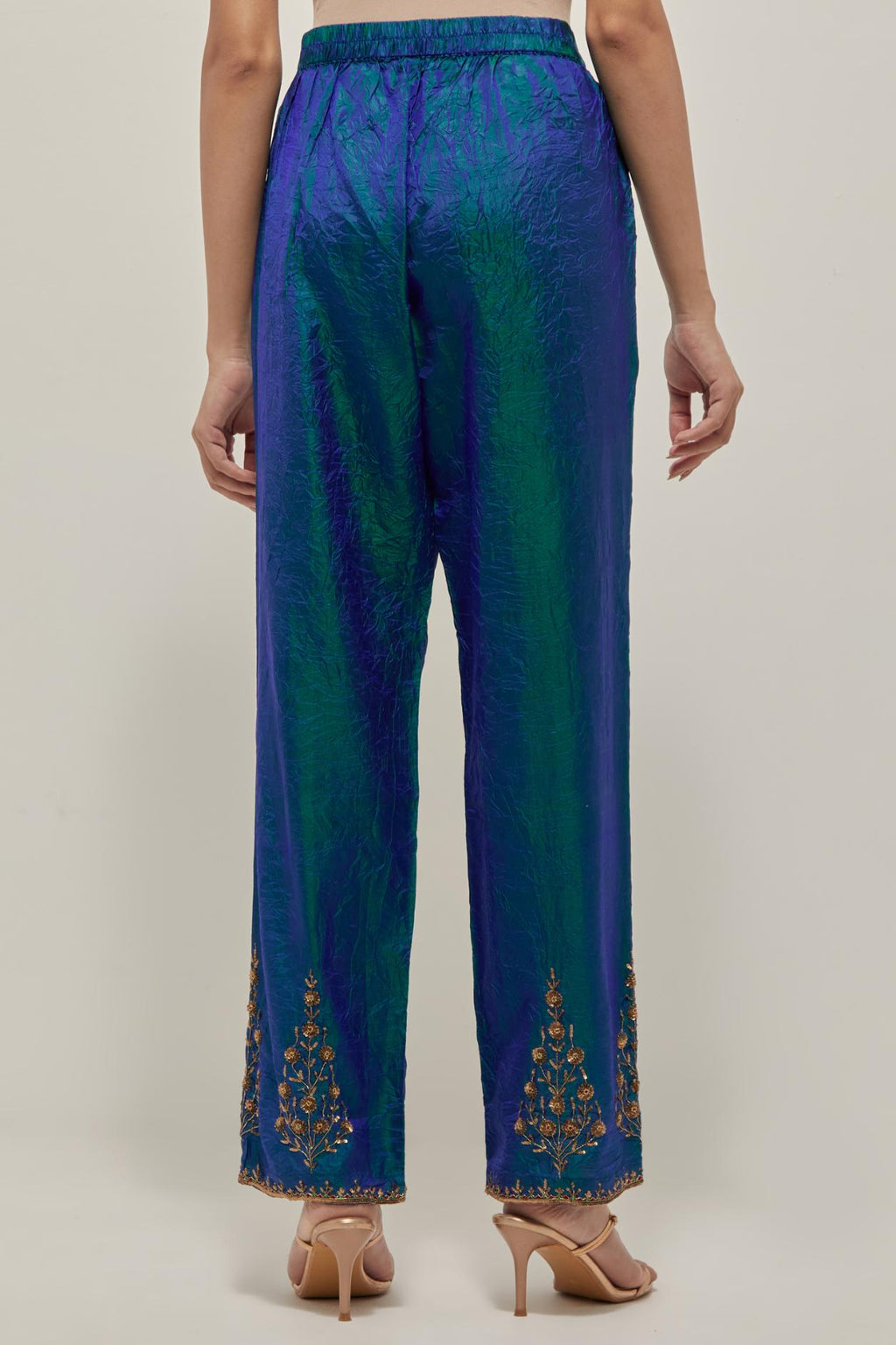 Teal Blue Silk pants, highlighted with hand embroidered bead, sequins and zardozi boota at hem, highlighted with contrast bead work.