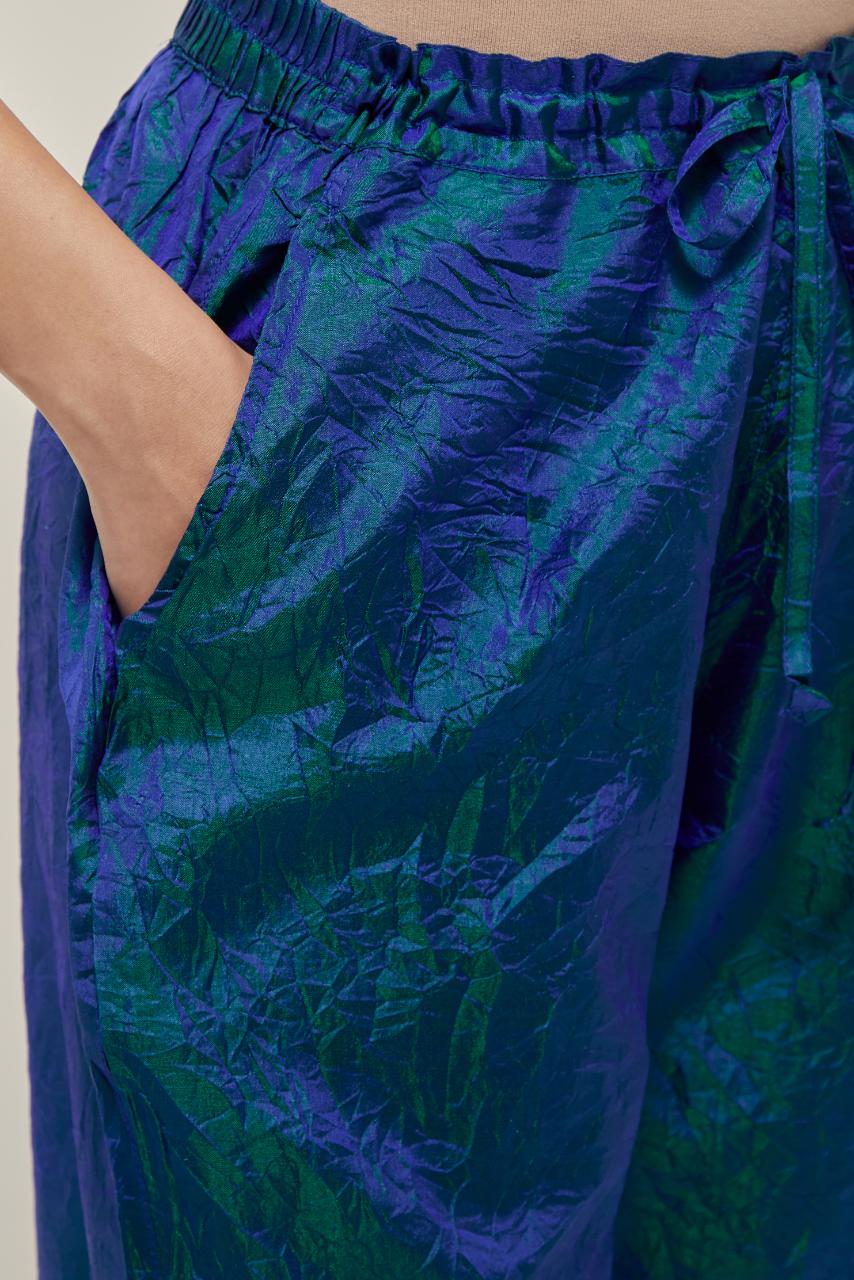 Teal Blue Silk pants, highlighted with hand embroidered bead, sequins and zardozi boota at hem, highlighted with contrast bead work.