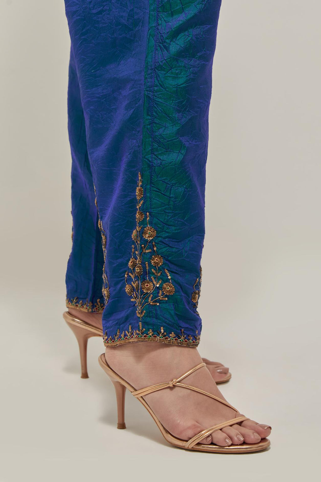 Teal Blue Silk pants, highlighted with hand embroidered bead, sequins and zardozi boota at hem, highlighted with contrast bead work.
