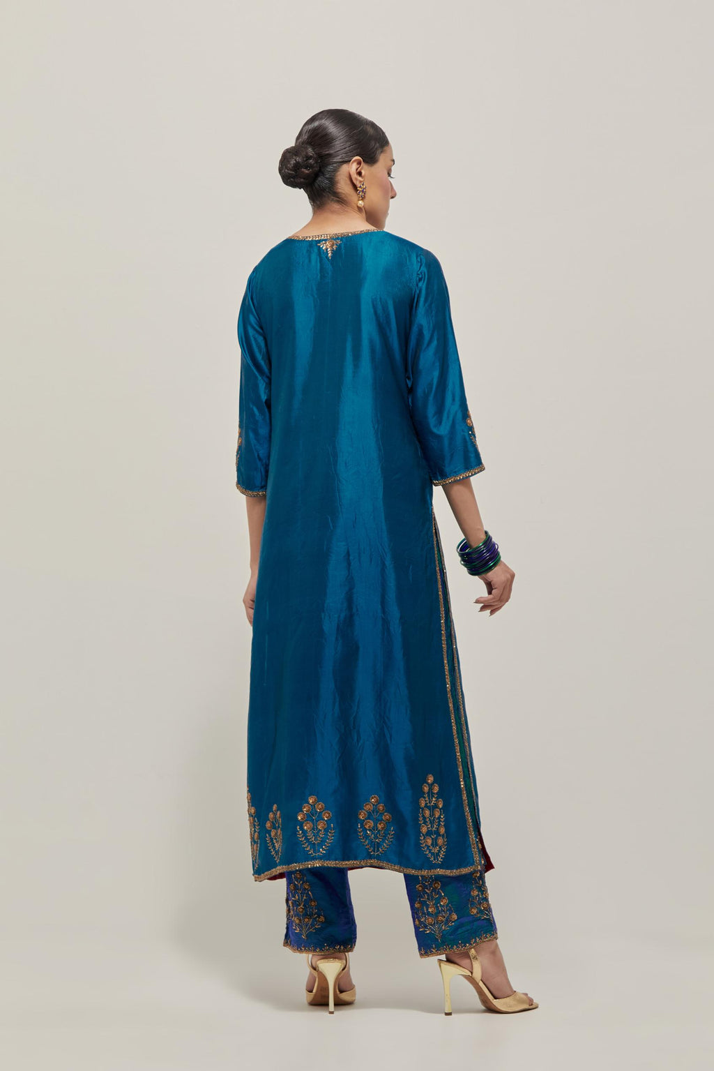 Teal double toned silk straight Kurta set with hand embroidered zardozi and sequins, highlighted with beads.