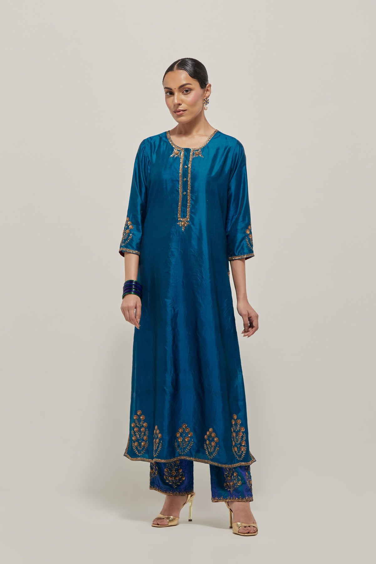 Teal double toned silk straight Kurta set with hand embroidered zardozi and sequins, highlighted with beads.