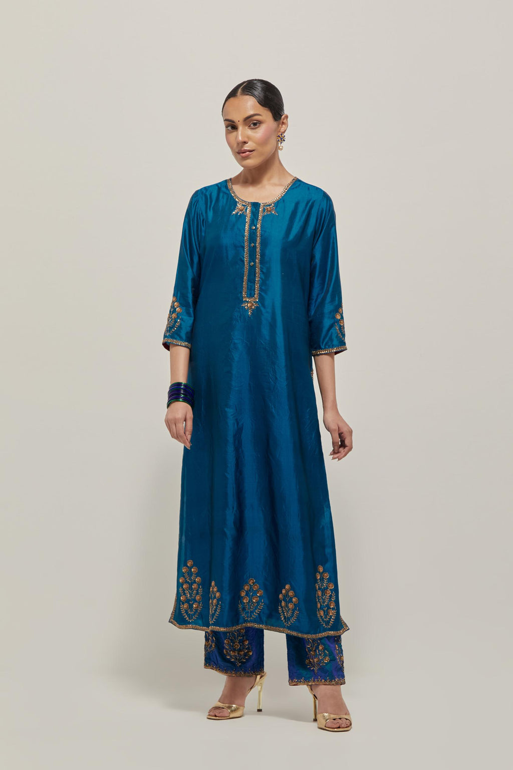 Teal double toned silk straight Kurta set with hand embroidered zardozi and sequins, highlighted with beads.