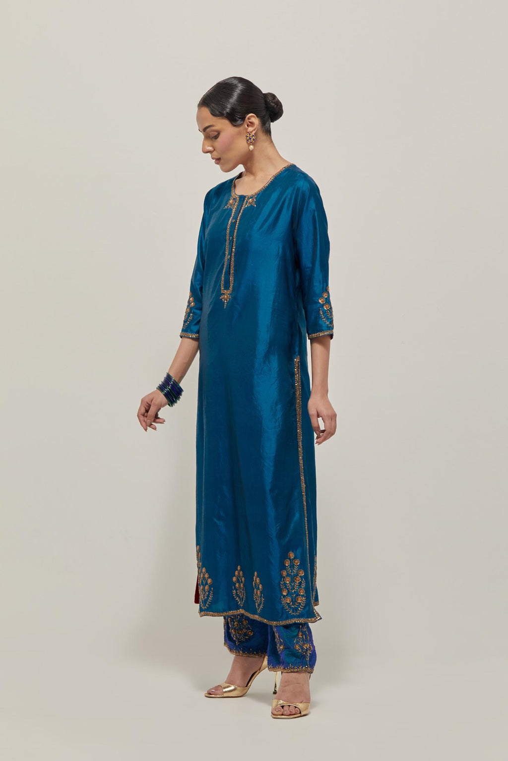 Teal double toned silk straight Kurta set with hand embroidered zardozi and sequins, highlighted with beads.