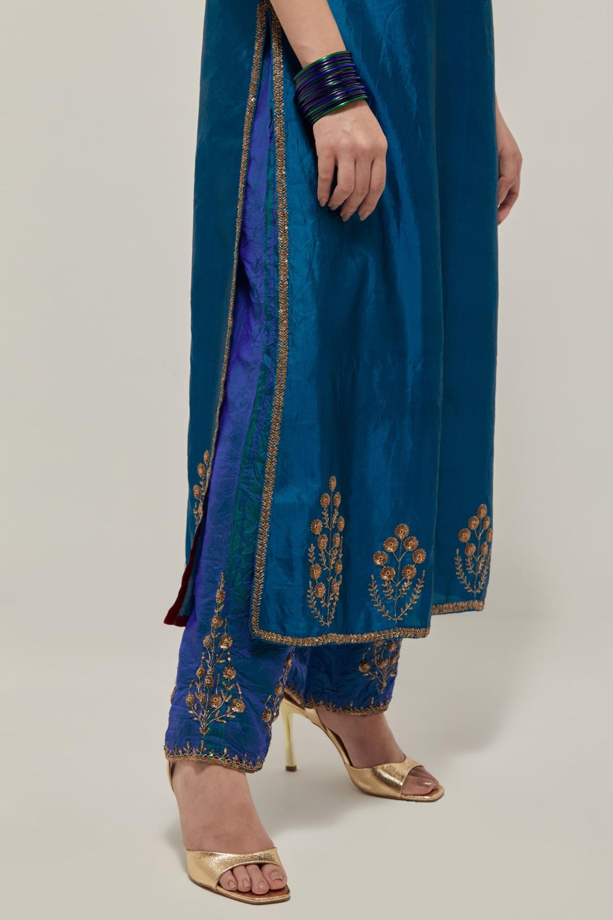 Teal double toned silk straight Kurta set with hand embroidered zardozi and sequins, highlighted with beads.