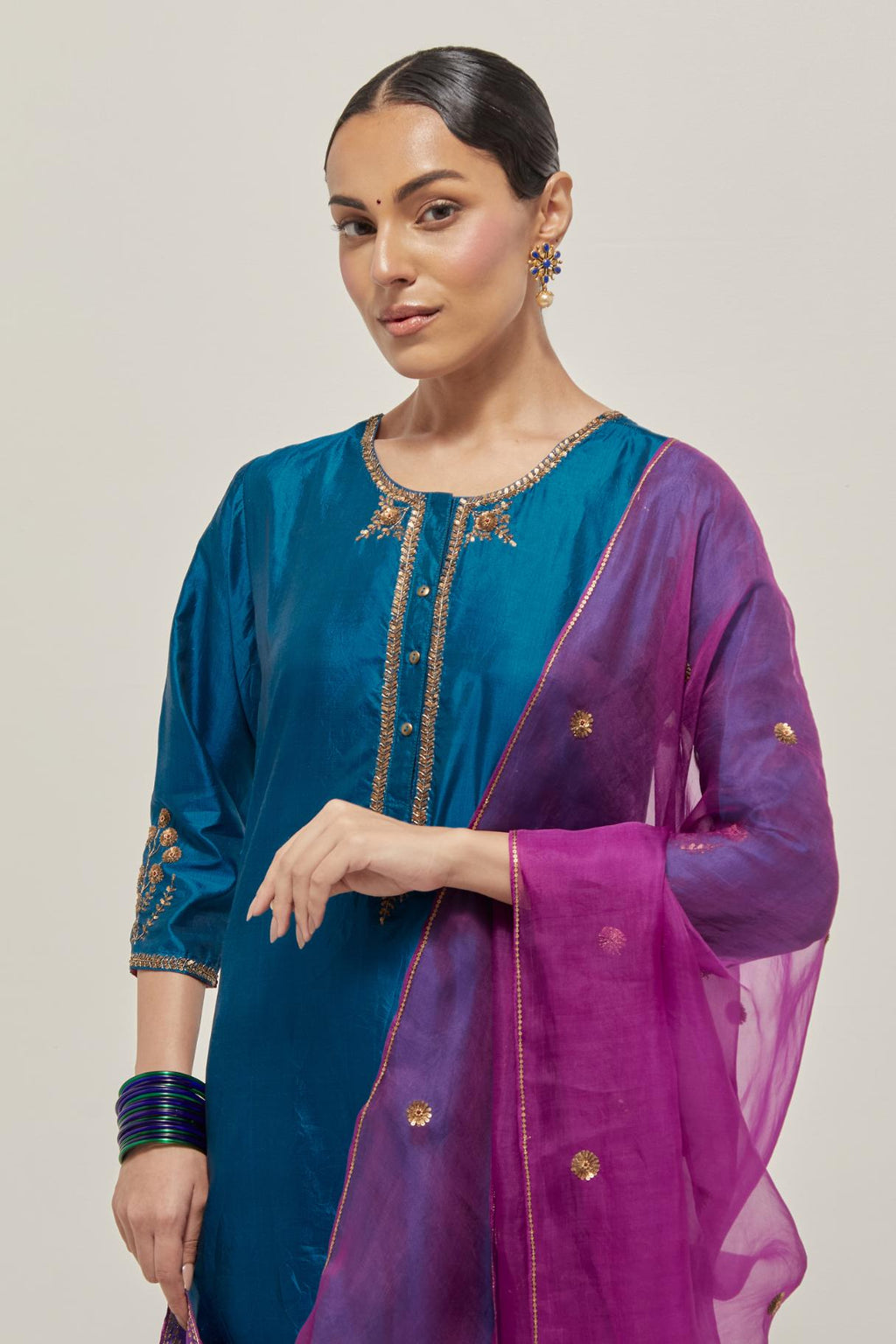 Purple silk organza dupatta with all-over delicate sequins and bead small booti, finished with applique bandhani-inspired motifs at all four corners.