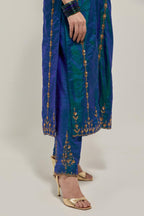 Teal Blue silk straight kurta set with round neck and slit in front. It has hand embroidered zardozi and sequins chhari stripes, all-over and heavier butas at hem, highlighted with beads.