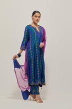 Teal Blue silk straight kurta set with round neck and slit in front. It has hand embroidered zardozi and sequins chhari stripes, all-over and heavier butas at hem, highlighted with beads.