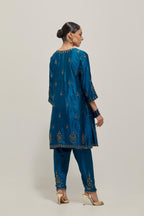 Teal double toned silk short kalidar kurta set, with hand embroidered zardozi and sequins, highlighted with beads.