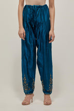 Teal Silk salwar, highlighted with hand embroidered bead, sequins and zardozi boota at hem, highlighted with contrast bead work.