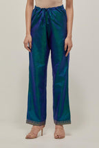 Teal Blue silk pants with a narrow bandhani-inspired border at the hem, detailed with delicate bead and sequin work.