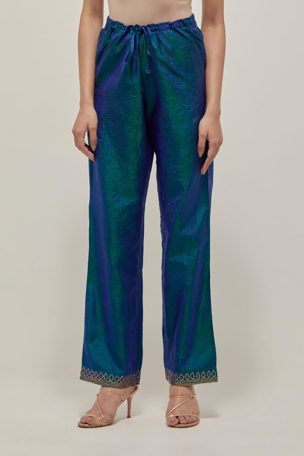 Teal Blue silk pants with a narrow bandhani-inspired border at the hem, detailed with delicate bead and sequin work.