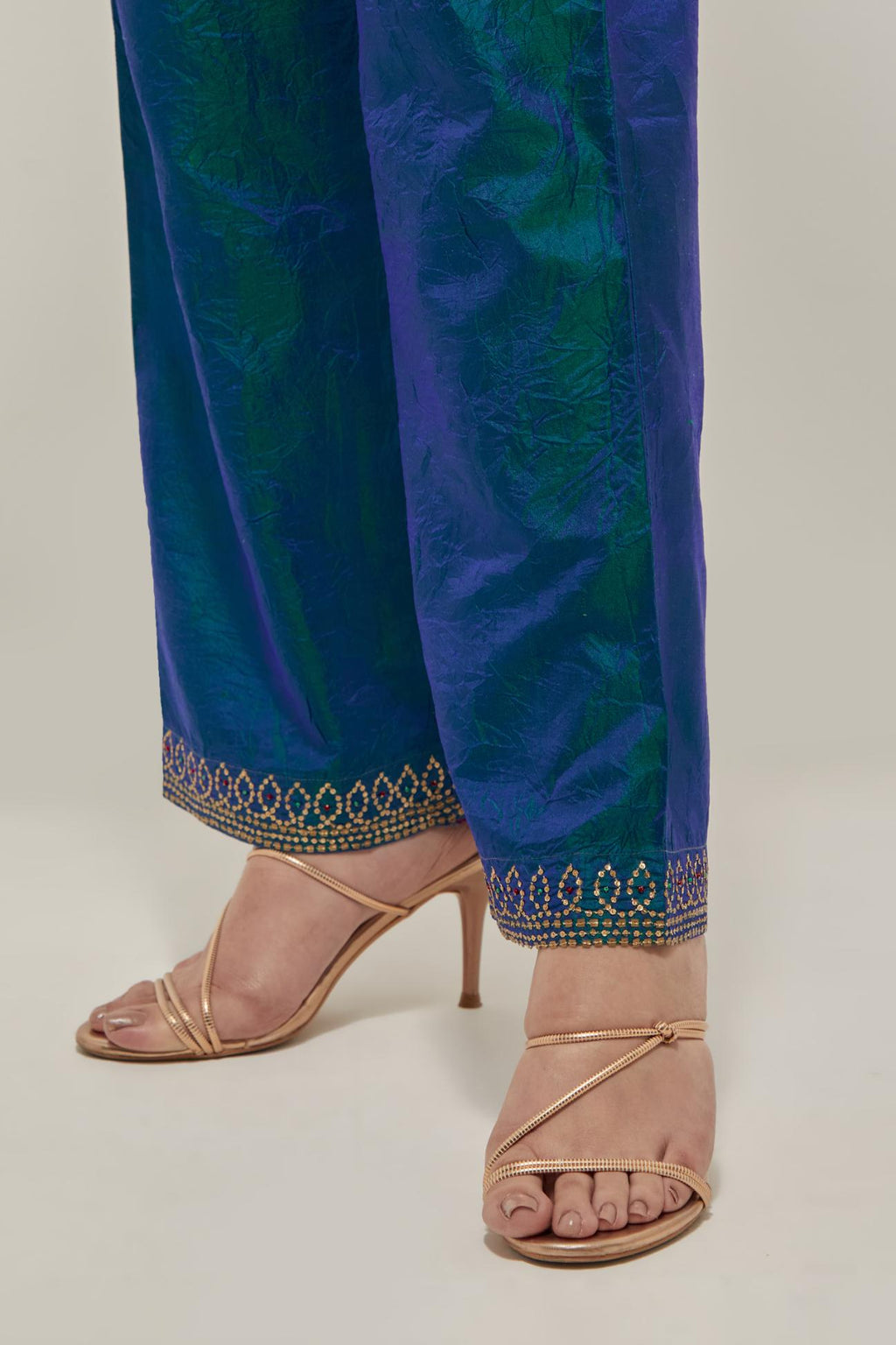 Teal Blue silk pants with a narrow bandhani-inspired border at the hem, detailed with delicate bead and sequin work.