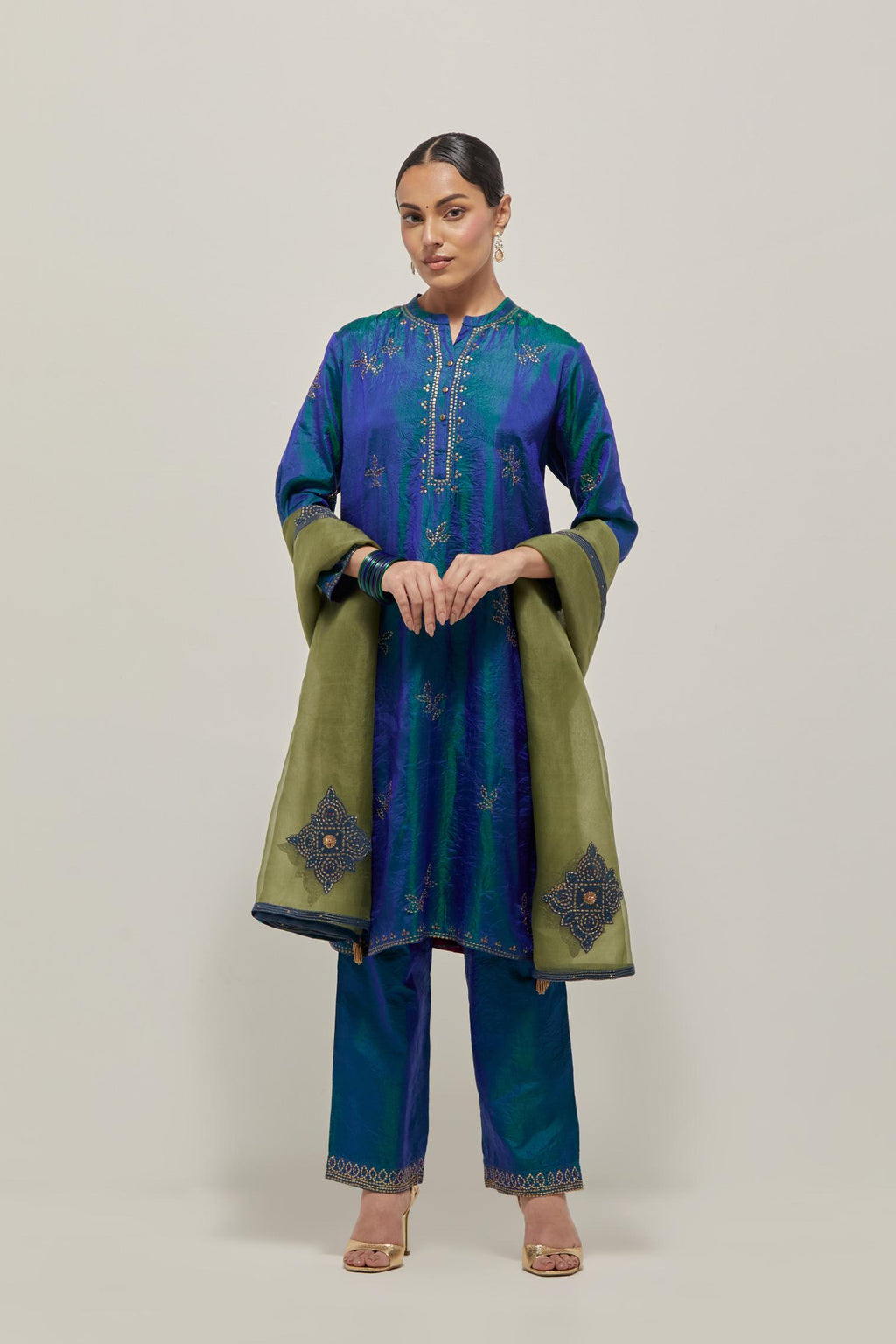 Teal Blue Silk short kurta set with hand embroidered sequins on bandhani inspired floral motifs all-over the kurta, highlighted with contrast-colored beads.