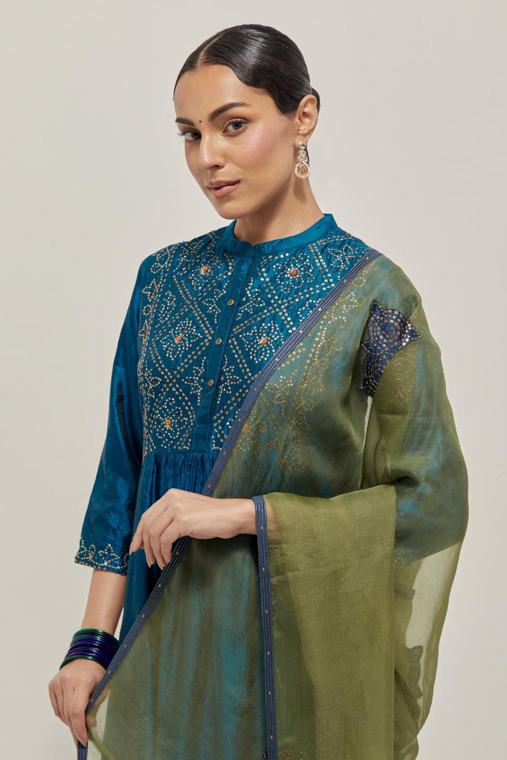 Green silk organza dupatta with all-over applique bandhani-inspired motifs, highlighted with contrast bead work.