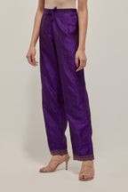 Purple silk pants with a narrow bandhani-inspired border at the hem, detailed with delicate bead and sequin work.