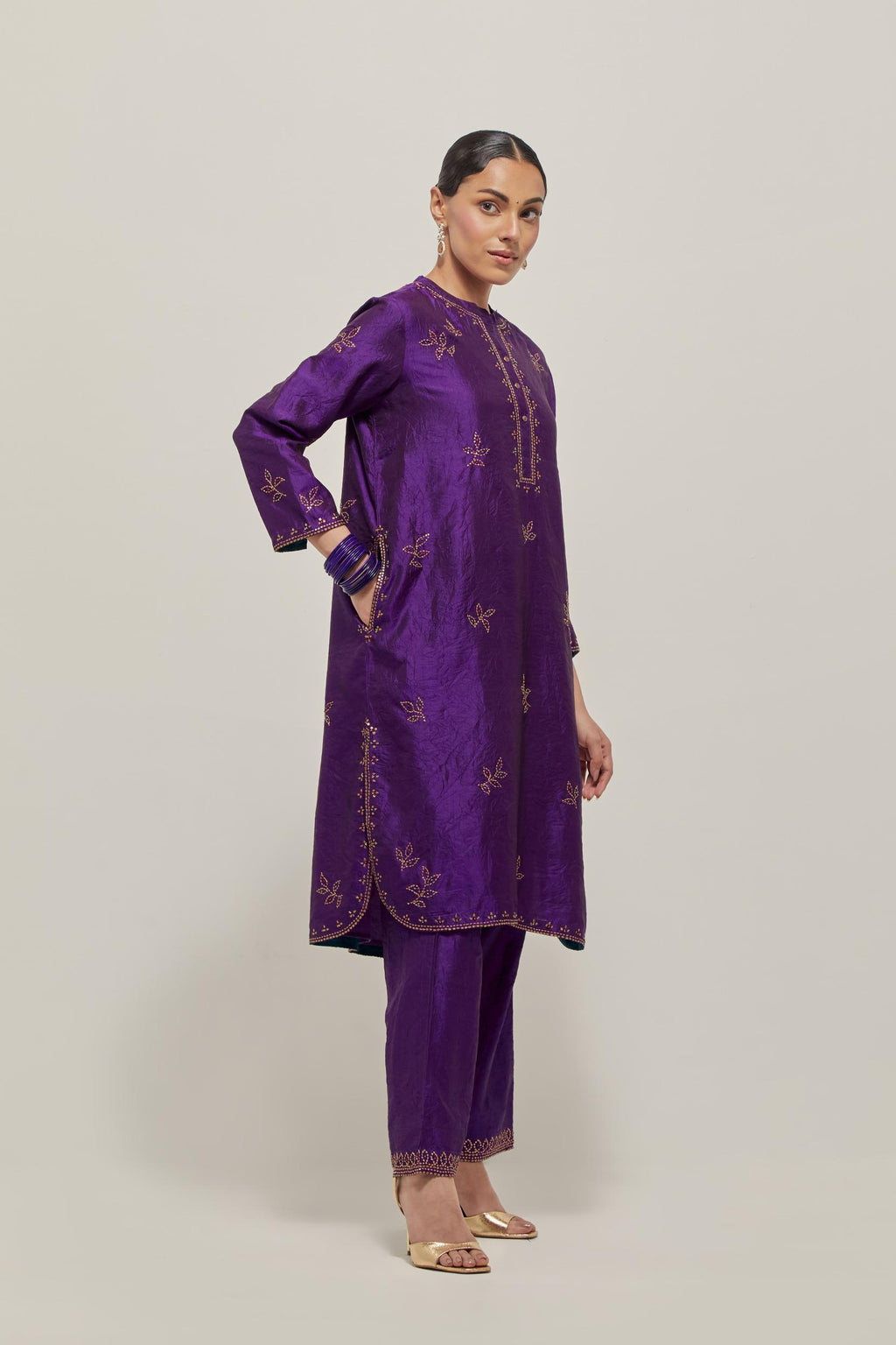 Purple Silk short kurta set with hand embroidered sequins on bandhani inspired floral motifs all-over the kurta, highlighted with contrast-colored beads.
