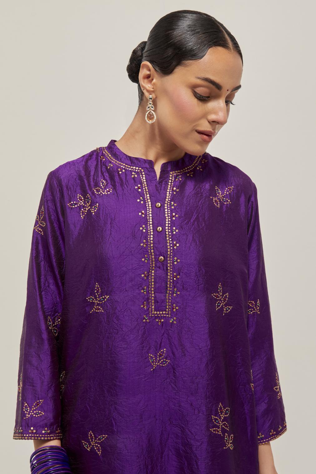 Purple Silk short kurta set with hand embroidered sequins on bandhani inspired floral motifs all-over the kurta, highlighted with contrast-colored beads.