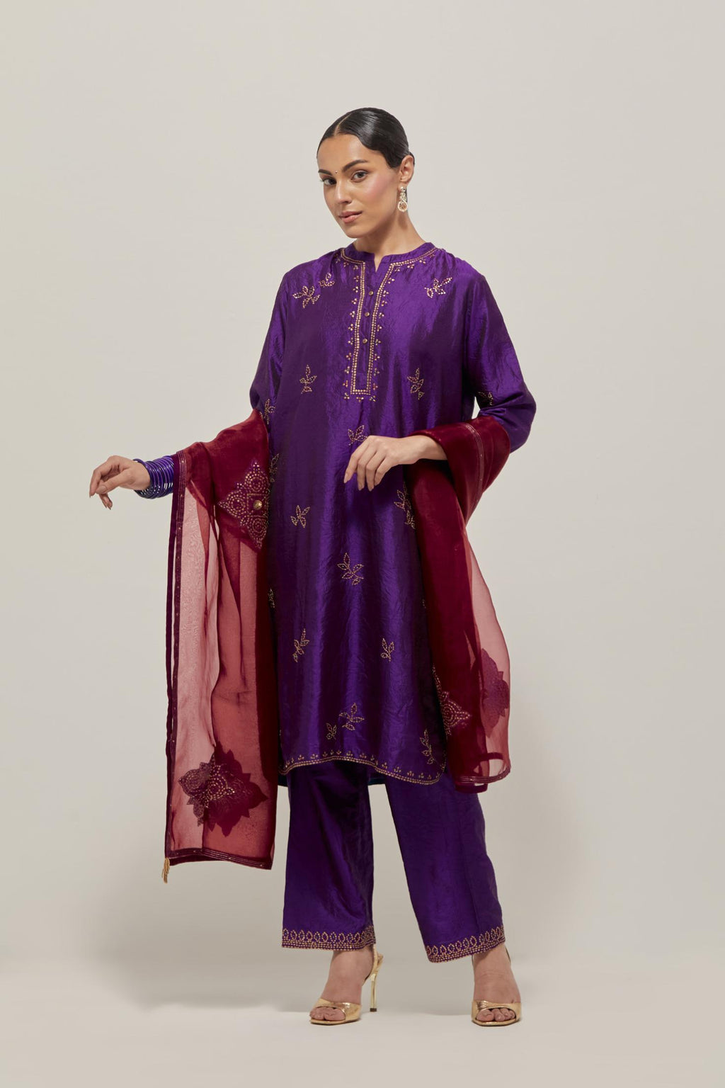 Purple Silk short kurta set with hand embroidered sequins on bandhani inspired floral motifs all-over the kurta, highlighted with contrast-colored beads.