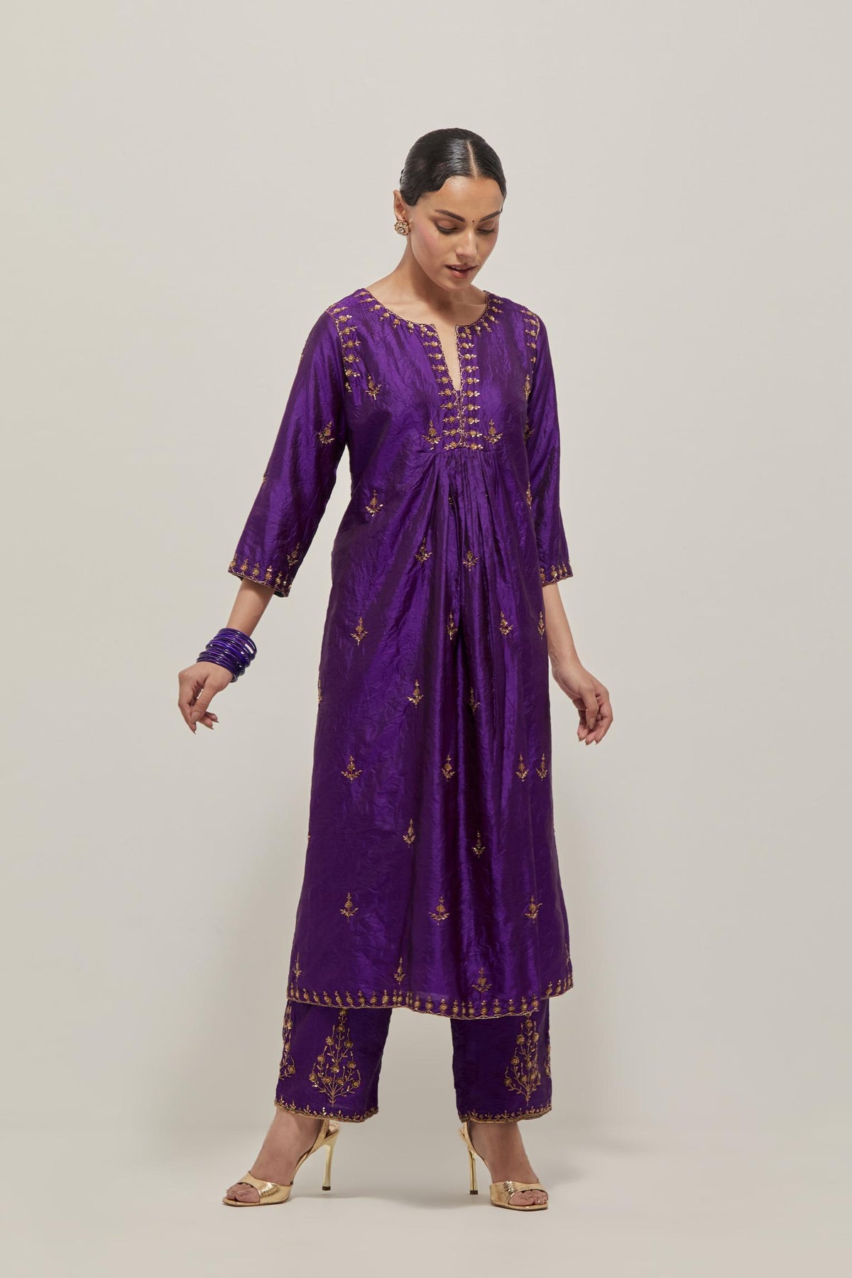 Purple double toned silk Kurta set dress with all-over hand embroidered zardozi and sequins, highlighted with beads.