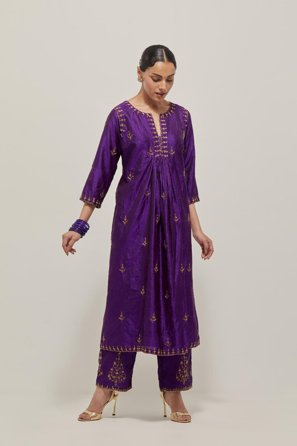 Purple double toned silk Kurta set dress with all-over hand embroidered zardozi and sequins, highlighted with beads.