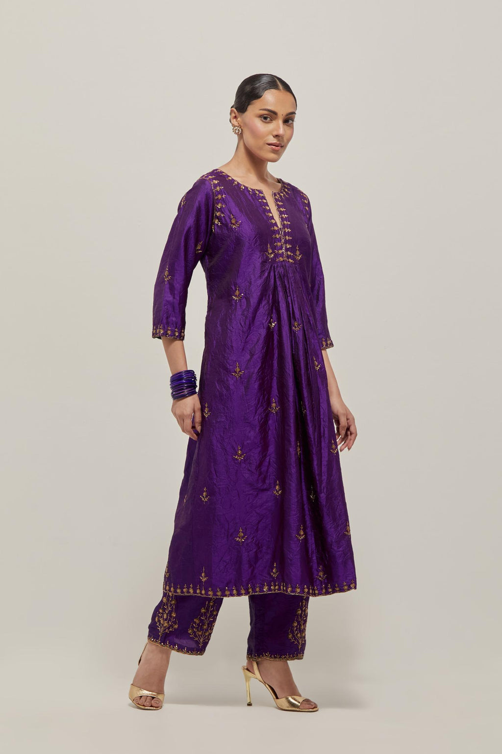 Purple double toned silk Kurta set dress with all-over hand embroidered zardozi and sequins, highlighted with beads.