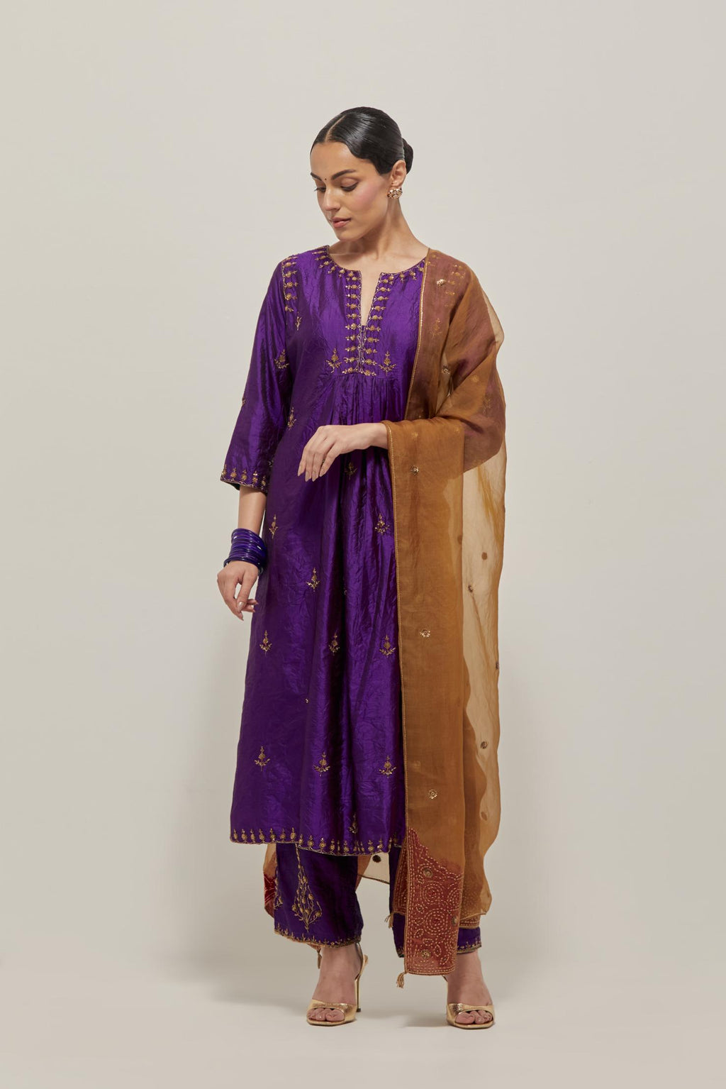 Purple double toned silk Kurta set dress with all-over hand embroidered zardozi and sequins, highlighted with beads.