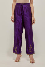 Purple Silk pants, highlighted with hand embroidered bead, sequins and zardozi boota at hem, highlighted with contrast bead work.