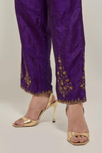 Purple Silk pants, highlighted with hand embroidered bead, sequins and zardozi boota at hem, highlighted with contrast bead work.