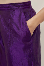 Purple Silk pants, highlighted with hand embroidered bead, sequins and zardozi boota at hem, highlighted with contrast bead work.