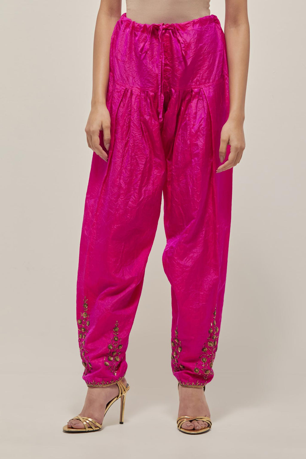 Fuchsia Silk salwar, highlighted with hand embroidered bead, sequins and zardozi boota at hem, highlighted with contrast bead work.