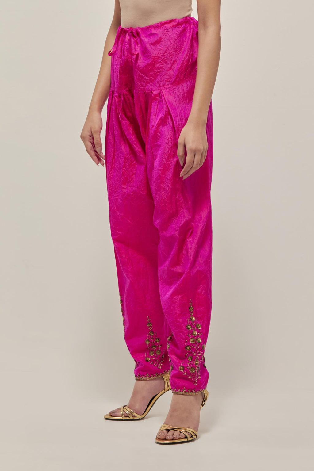 Fuchsia Silk salwar, highlighted with hand embroidered bead, sequins and zardozi boota at hem, highlighted with contrast bead work.