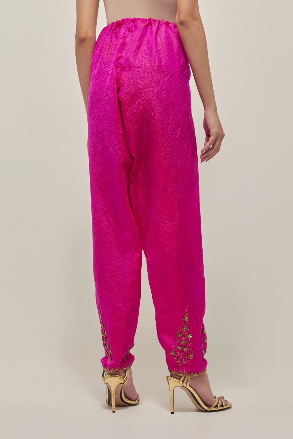 Fuchsia Silk salwar, highlighted with hand embroidered bead, sequins and zardozi boota at hem, highlighted with contrast bead work.