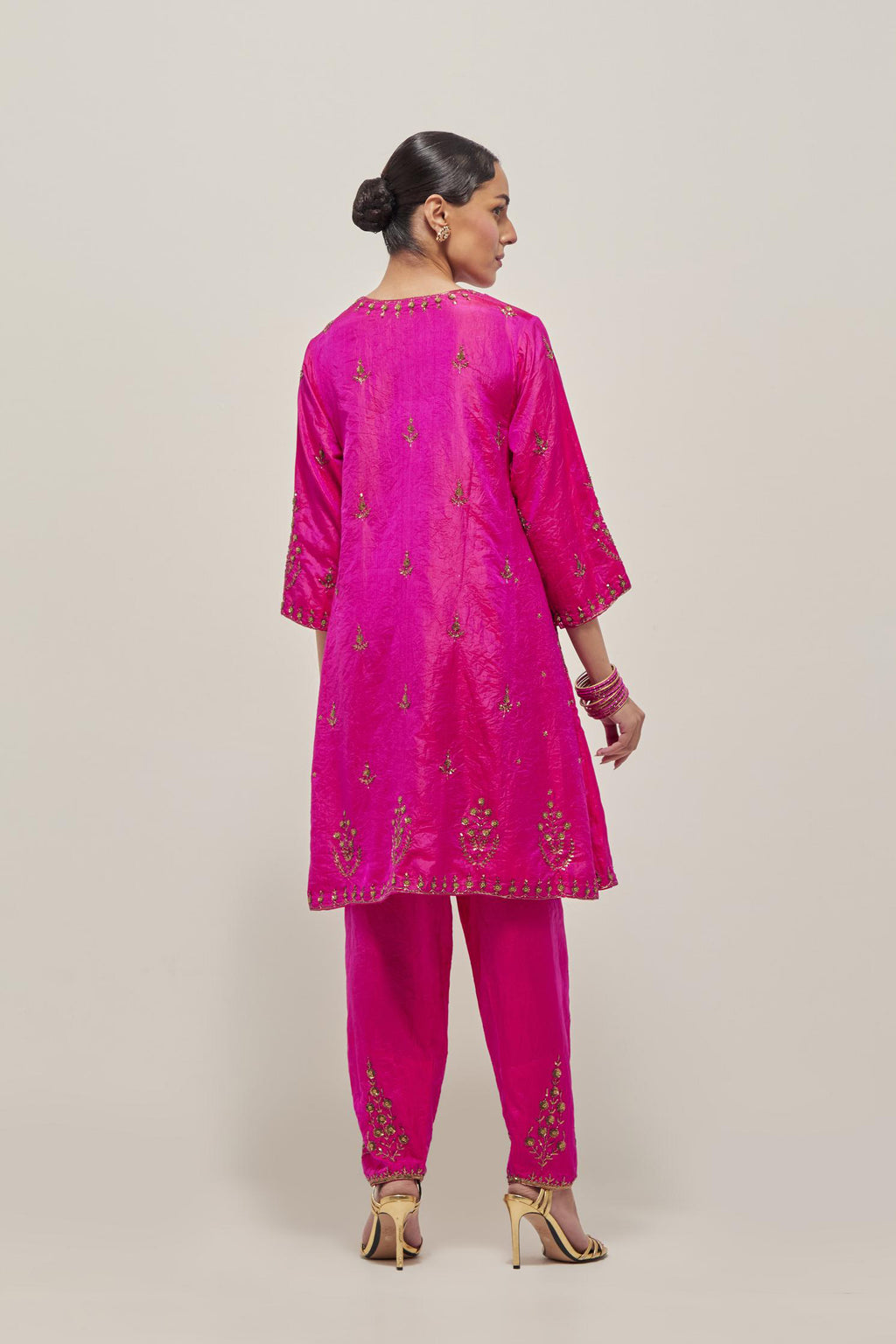 Fuchsia double toned silk short kalidar kurta set, with hand embroidered zardozi and sequins, highlighted with beads.