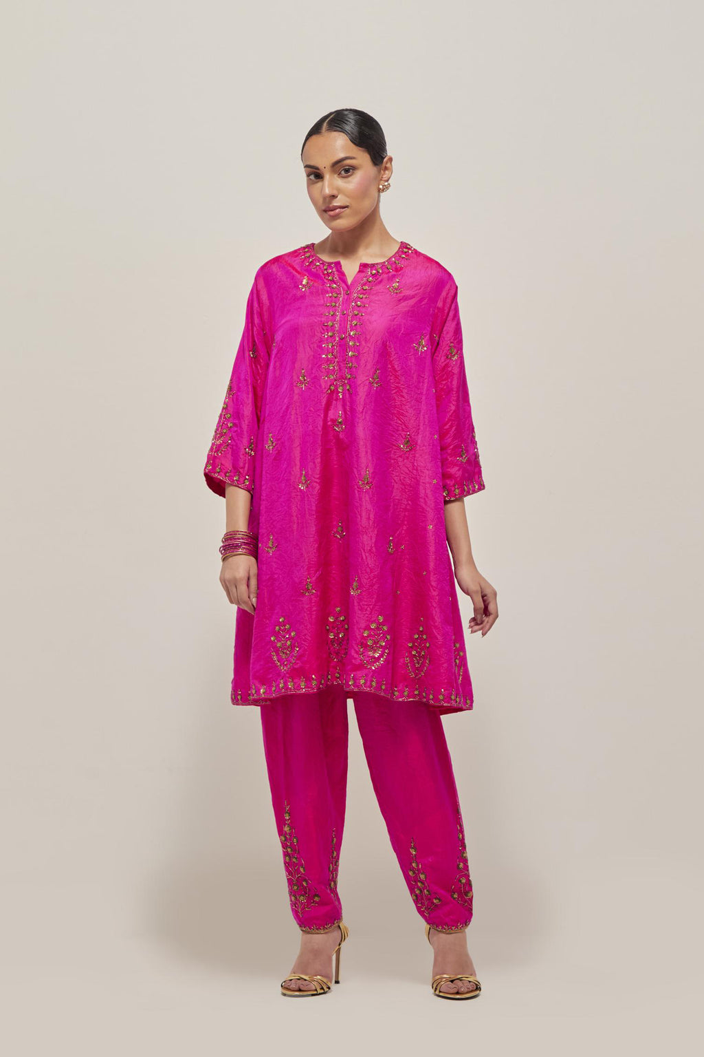Fuchsia double toned silk short kalidar kurta set, with hand embroidered zardozi and sequins, highlighted with beads.