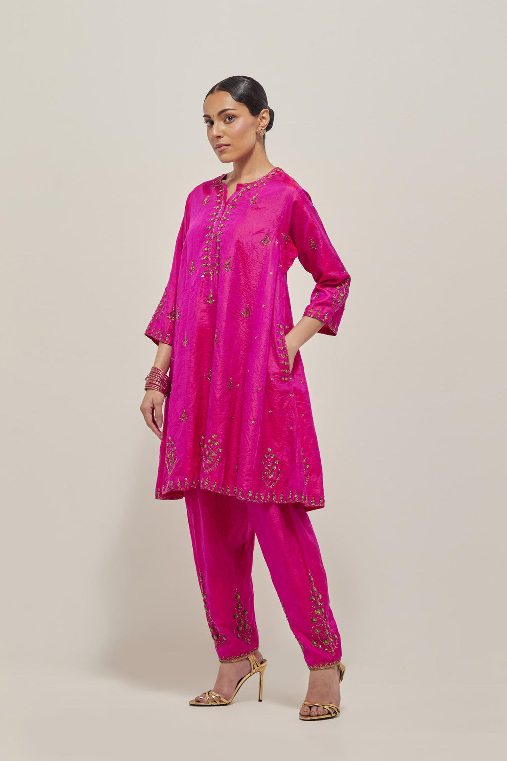 Fuchsia double toned silk short kalidar kurta set, with hand embroidered zardozi and sequins, highlighted with beads.
