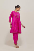 Fuchsia double toned silk short kalidar kurta set, with hand embroidered zardozi and sequins, highlighted with beads.