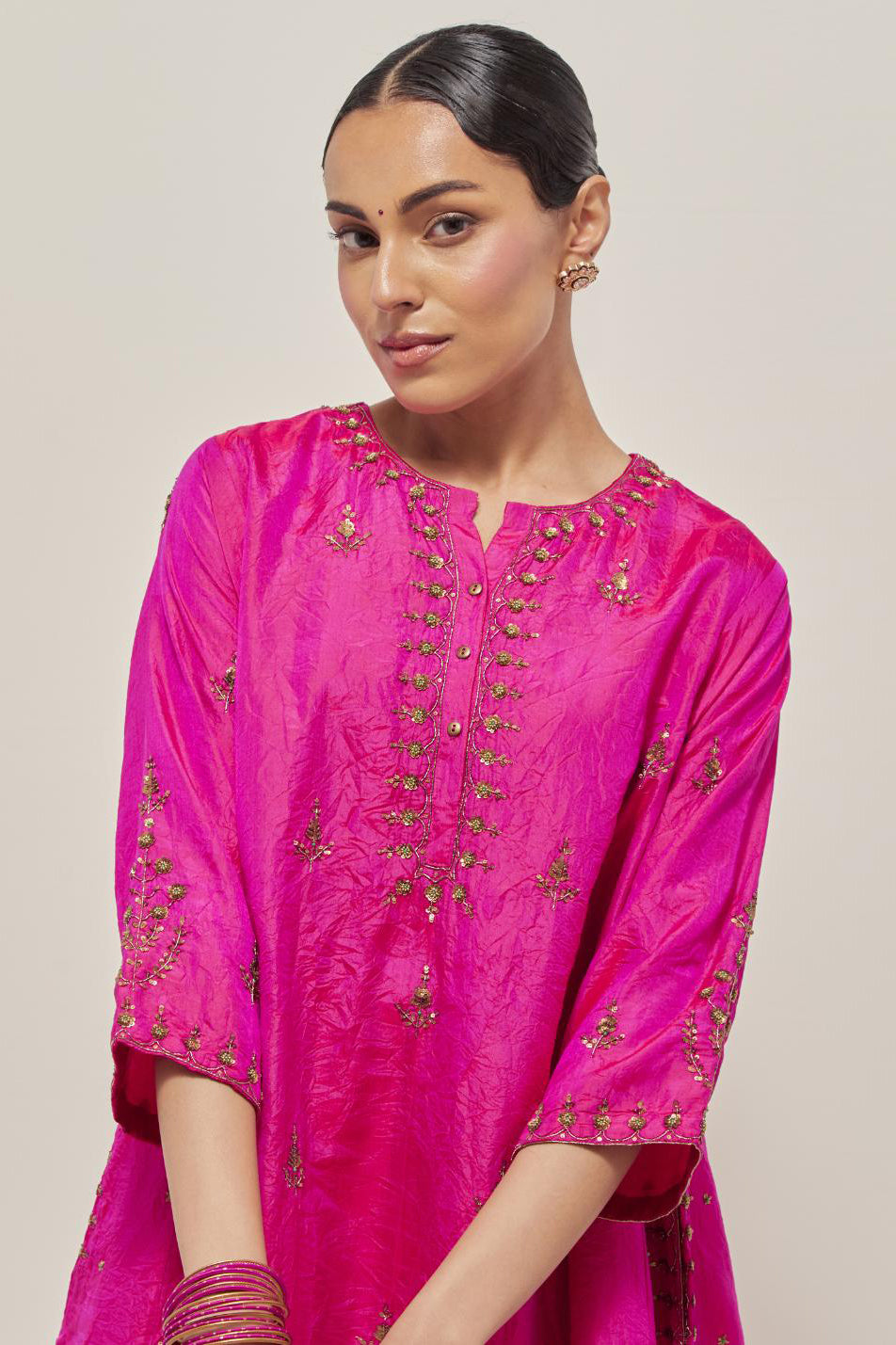 Fuchsia double toned silk short kalidar kurta set, with hand embroidered zardozi and sequins, highlighted with beads.