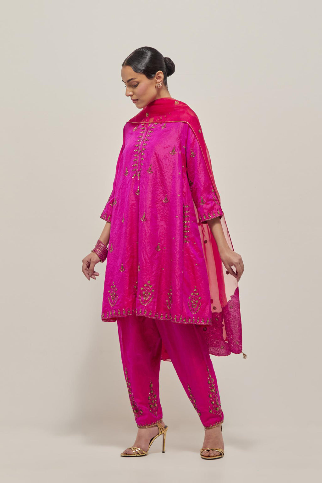 Fuchsia double toned silk short kalidar kurta set, with hand embroidered zardozi and sequins, highlighted with beads.