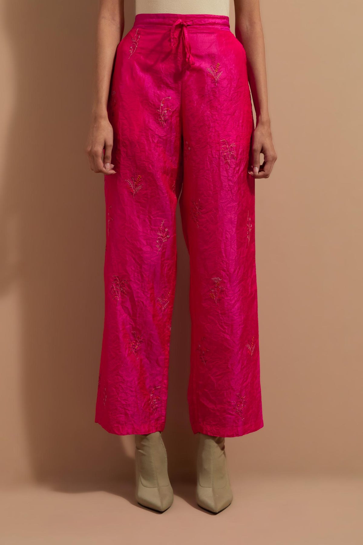 Fuchsia crushed silk hand block printed pants, highlighted with multi colored thread embroidery.